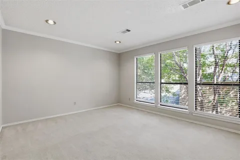 a view of room with window and ceiling fan