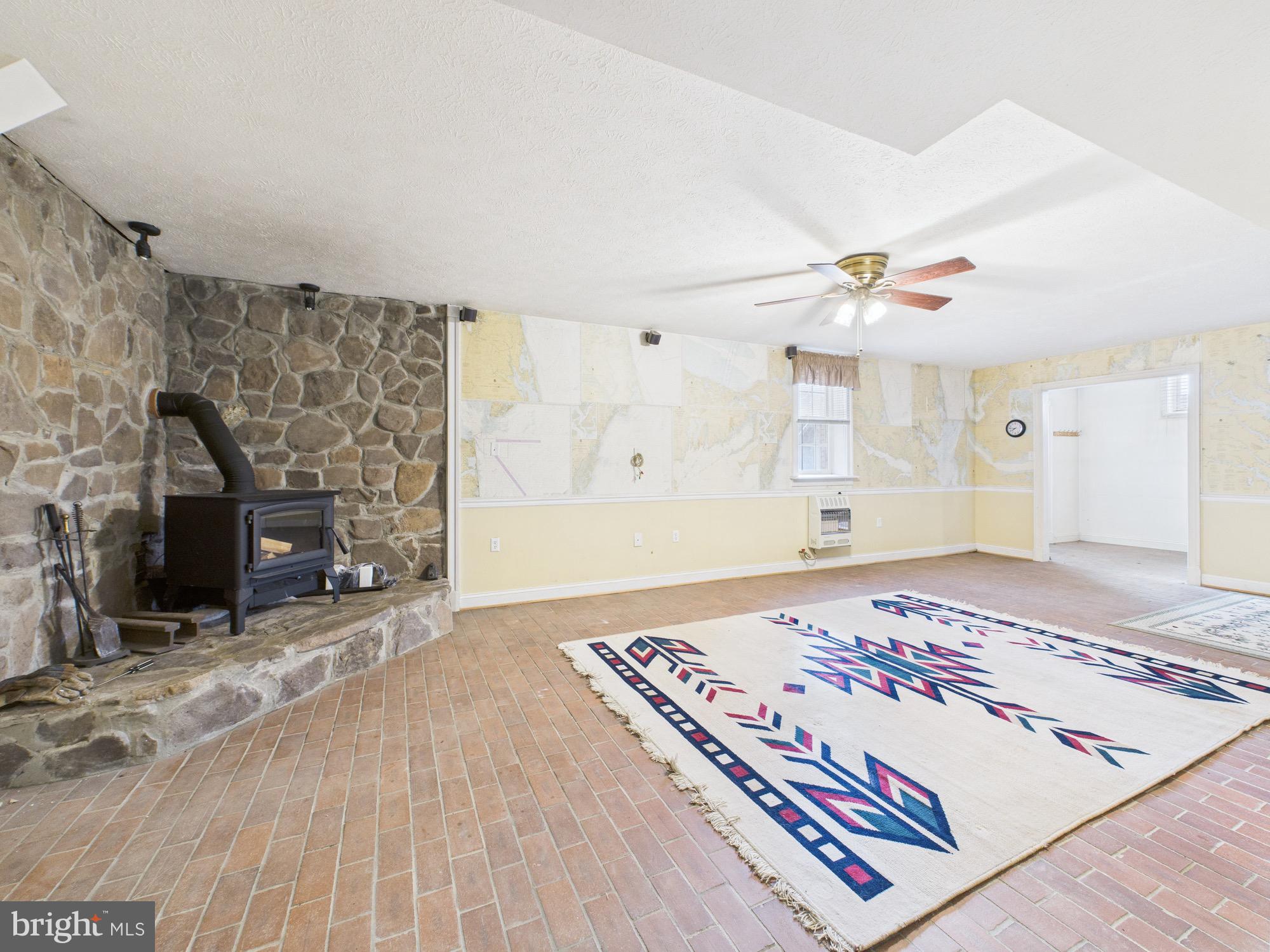 56 Smoot Road Woodstock, VA 22664 - Photo 35 of 52 a bedroom with a bed and a fireplace