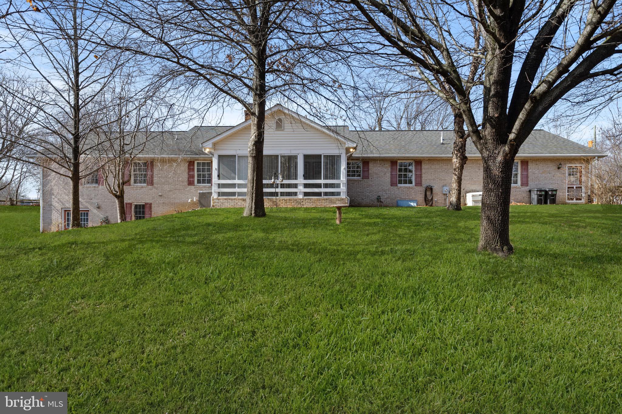 56 Smoot Road Woodstock, VA 22664 - Photo 44 of 52 a house view with a sitting space and garden