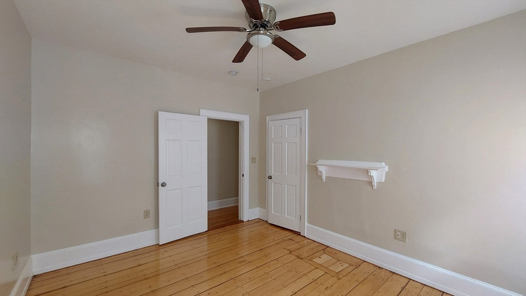 35 Catawba Street, Unit 2 Boston, MA 02119 - Photo 9 of 14 a view of empty room with wooden floor