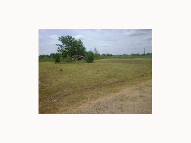 607 B Upper Elgin River Road Elgin, TX 78621 - Photo 1 of 1 a view of a lake from a yard