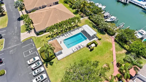 a kitchen with stainless steel appliances kitchen island granite countertop a stove a sink and a refrigerator