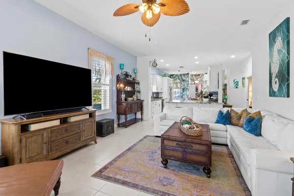 a living room with furniture workspace and a window