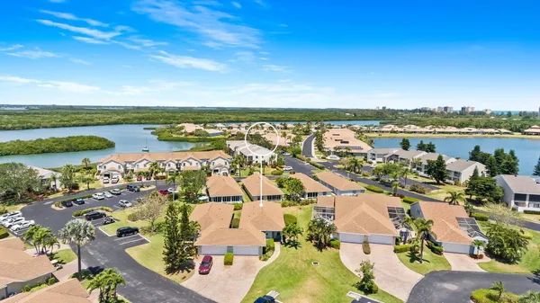 an aerial view of ocean with residential house with outdoor space