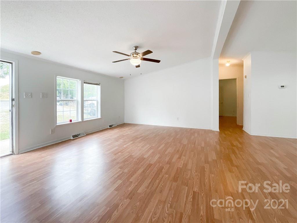 3512 Edwards Road Wingate, NC 28174 - Photo 11 of 42 a view of empty room with wooden floor and fan