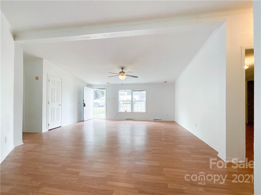 3512 Edwards Road Wingate, NC 28174 - Photo 12 of 42 a view of an empty room with window and wooden floor