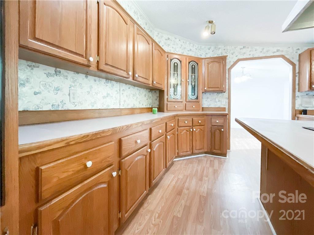 3512 Edwards Road Wingate, NC 28174 - Photo 18 of 42 a kitchen with stainless steel appliances granite countertop a sink and cabinets