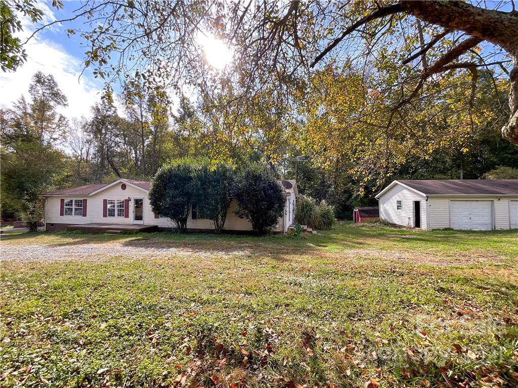 3512 Edwards Road Wingate, NC 28174 - Photo 3 of 42 a front view of a house with a yard