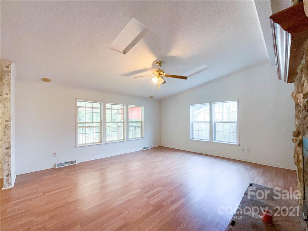 3512 Edwards Road Wingate, NC 28174 - Photo 22 of 42 an empty room with wooden floor and windows