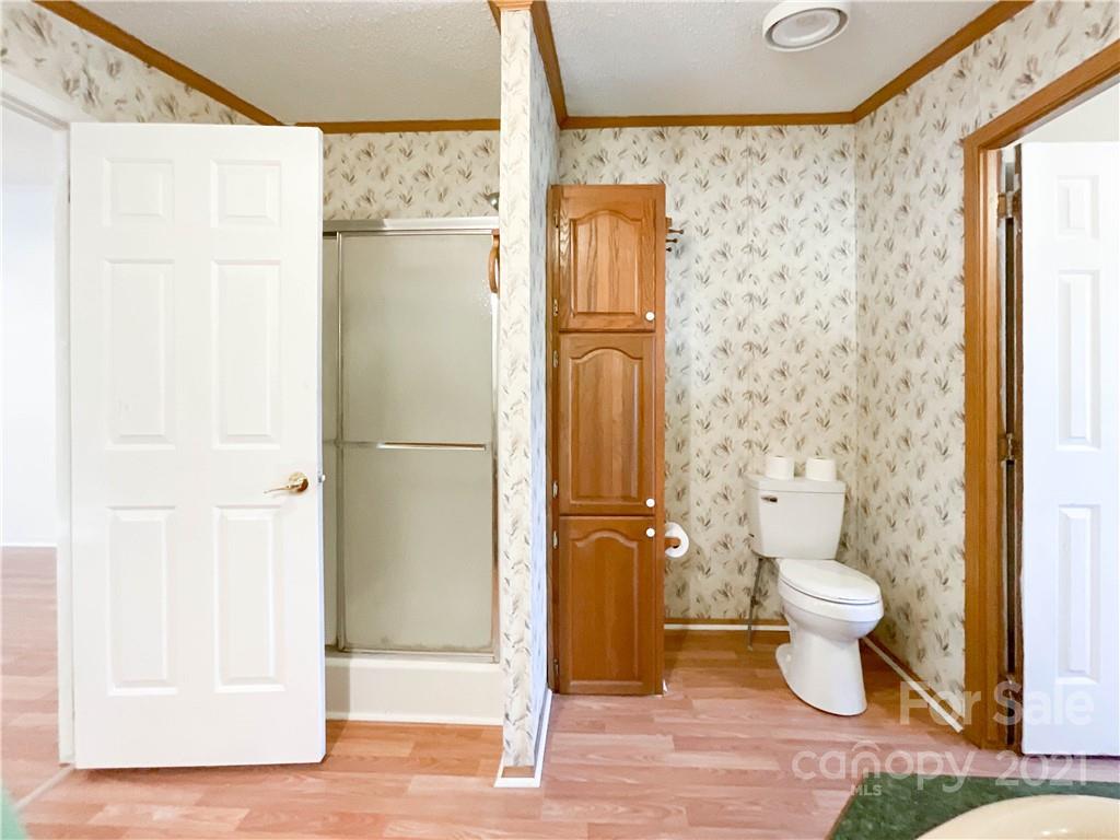 3512 Edwards Road Wingate, NC 28174 - Photo 28 of 42 a bathroom with a toilet and a shower