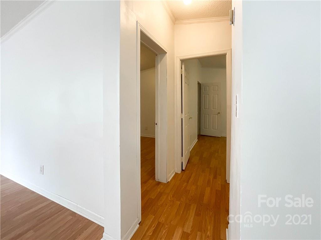 3512 Edwards Road Wingate, NC 28174 - Photo 30 of 42 a view of a hallway with wooden floor
