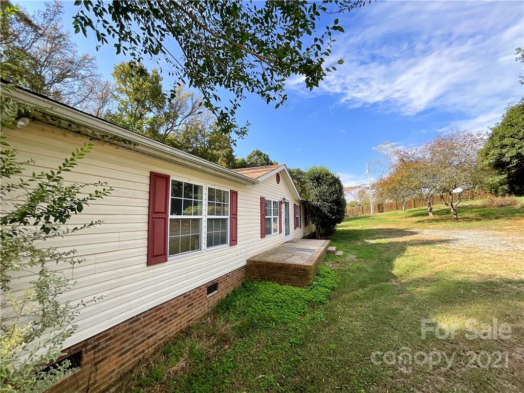 3512 Edwards Road Wingate, NC 28174 - Photo 4 of 42 a view of a house with a backyard
