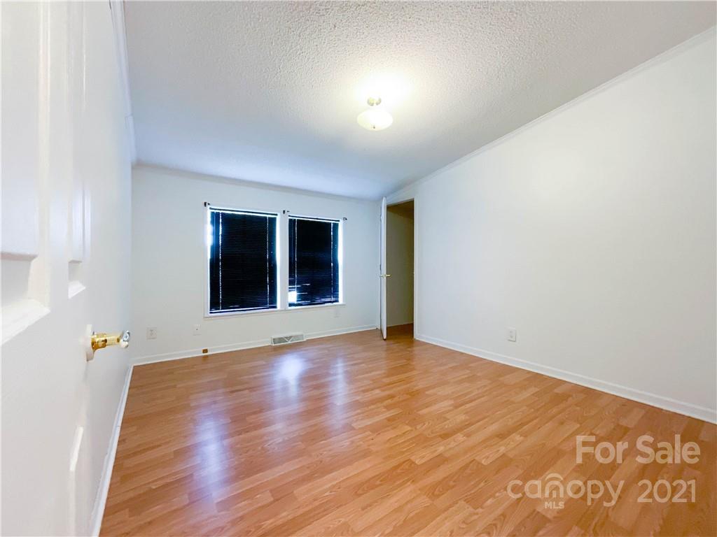 3512 Edwards Road Wingate, NC 28174 - Photo 31 of 42 a view of an empty room with wooden floor and a window