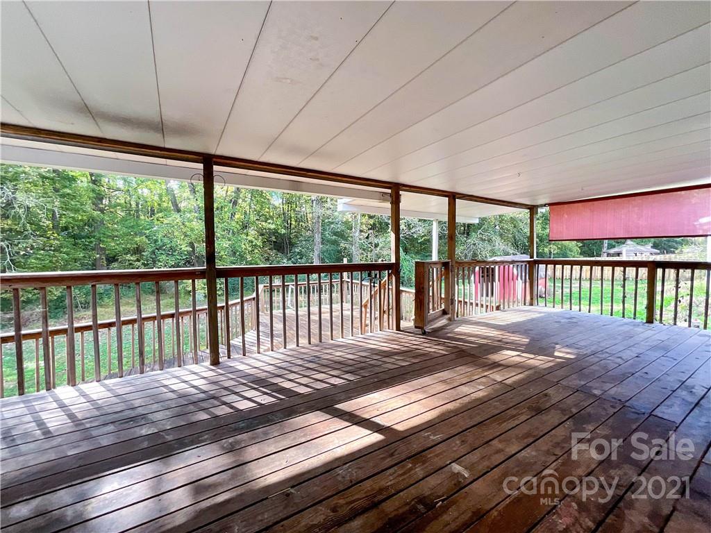 3512 Edwards Road Wingate, NC 28174 - Photo 40 of 42 a bedroom with a bed and wooden floor