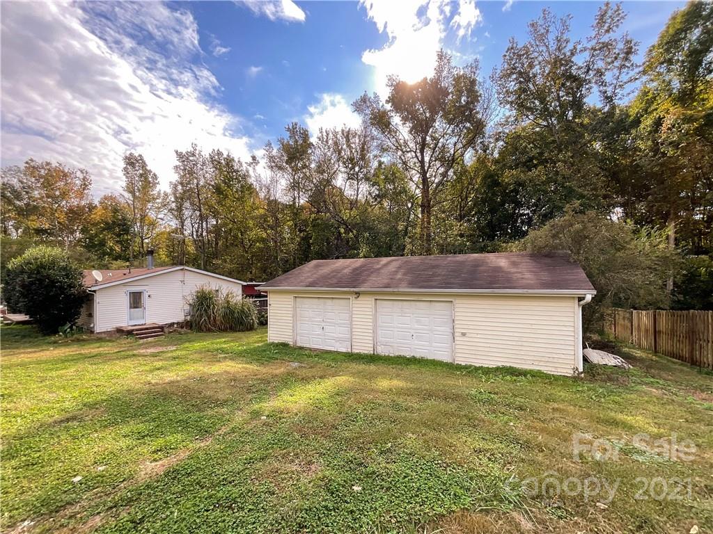 3512 Edwards Road Wingate, NC 28174 - Photo 7 of 42 a view of a house with a yard and garage