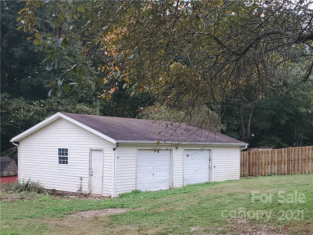3512 Edwards Road Wingate, NC 28174 - Photo 8 of 42 a view of a house with a yard and a large tree