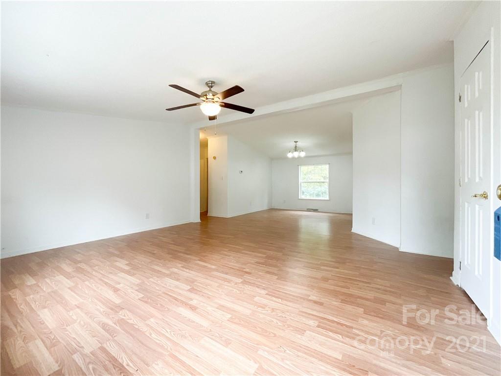 3512 Edwards Road Wingate, NC 28174 - Photo 10 of 42 a view of empty room with wooden floor and fan
