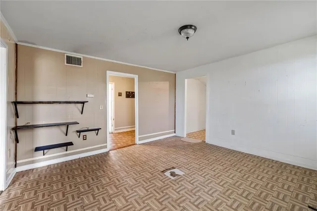 a view of an empty room with a window