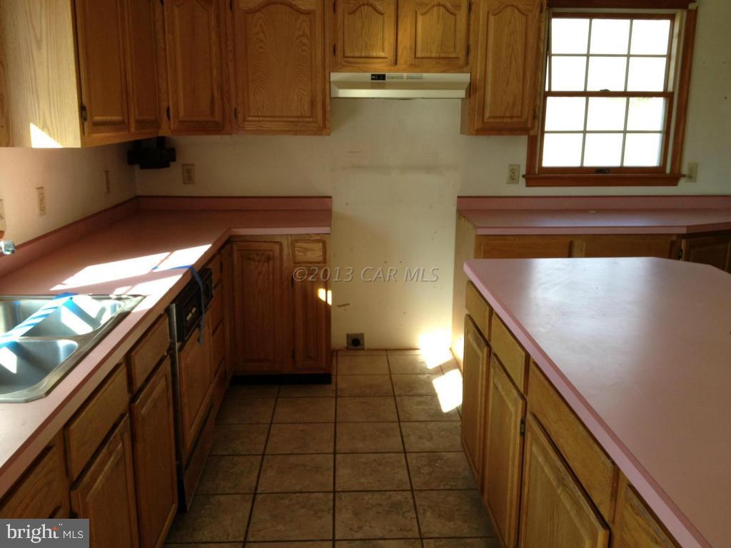 35320 Tingle Road Willards, MD 21874 - Photo 4 of 14 a kitchen with a sink and cabinets