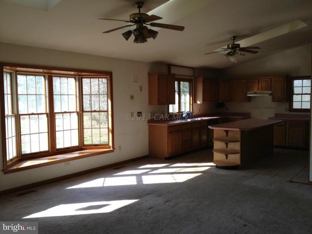 35320 Tingle Road Willards, MD 21874 - Photo 6 of 14 a view of a kitchen with a sink cabinets and a window