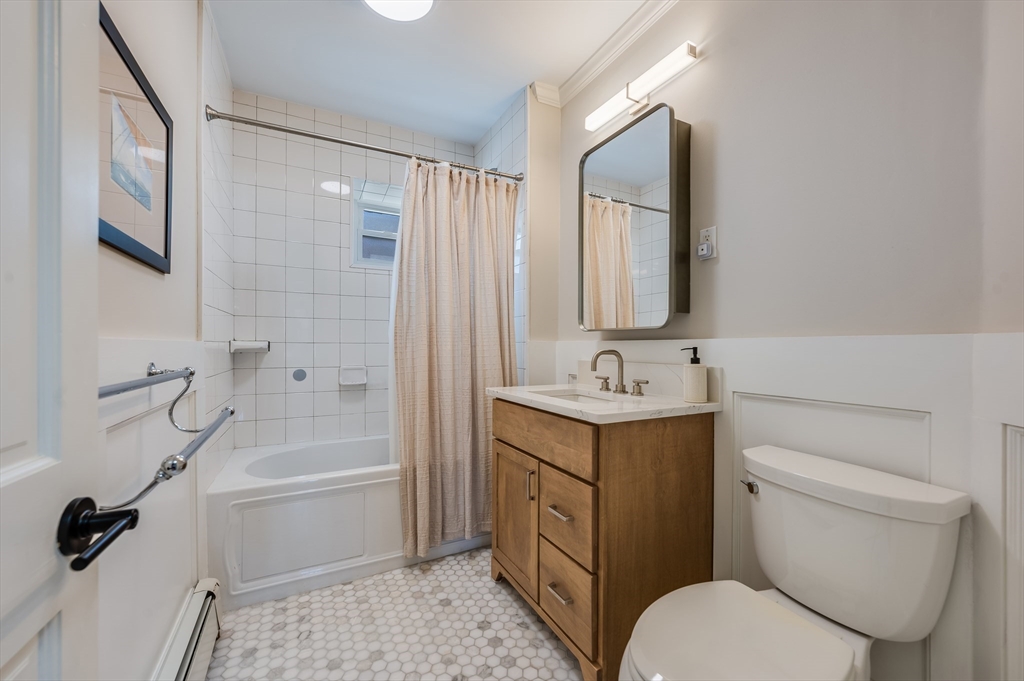 39 Emerson Street Boston, MA 02127 - Photo 15 of 20 a bathroom with a sink toilet and shower