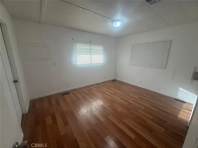 a kitchen with a sink a stove and cabinets