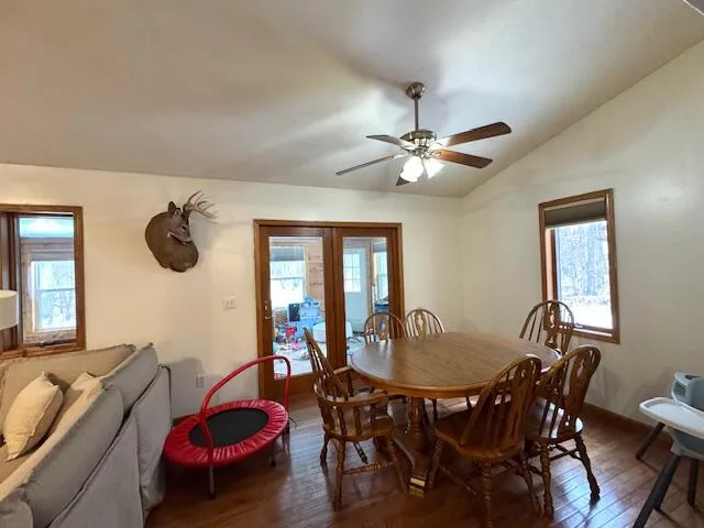 a dining room with furniture and window