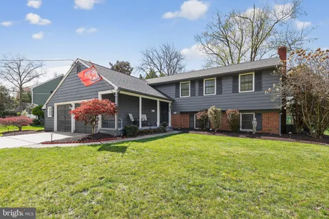 a front view of house with yard and outdoor seating