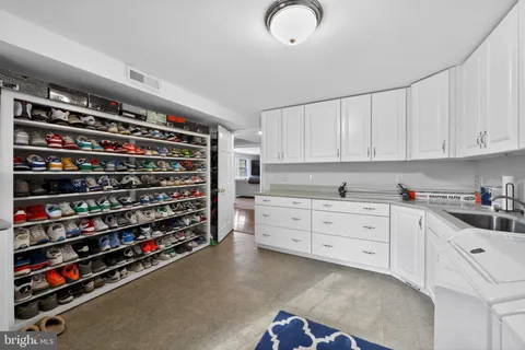 a kitchen with stainless steel appliances cabinets and a window