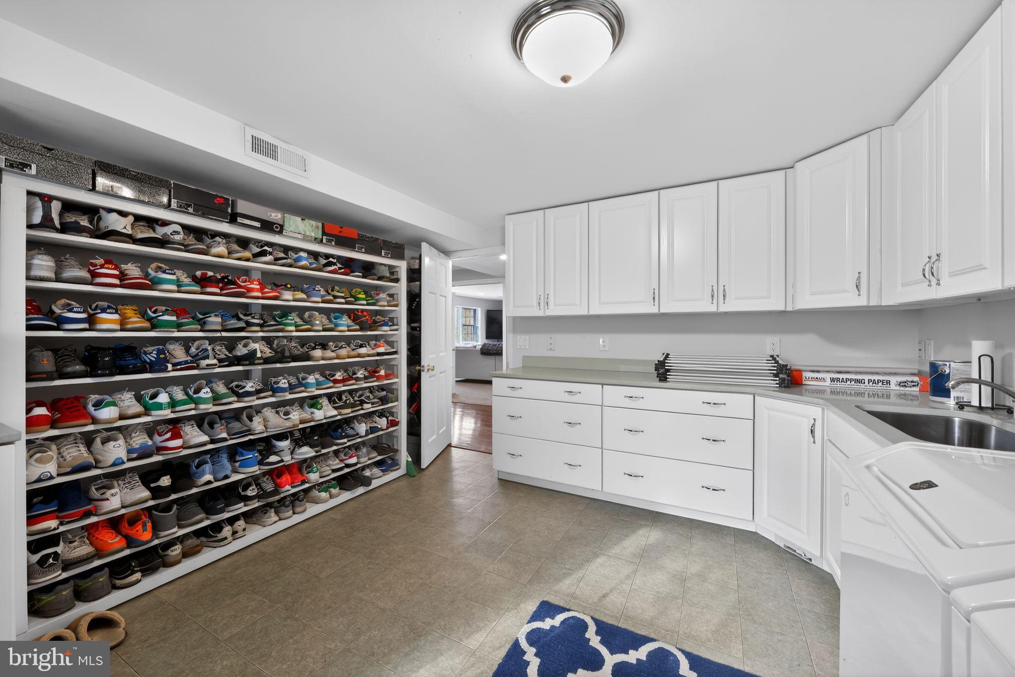 123 Pearl Croft Road Cherry Hill, NJ 08034 - Photo 24 of 41 Spacious laundry room with organized shoe storage.