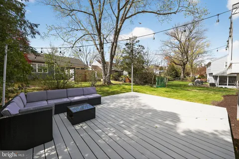 a view of a backyard with wooden floor and lake view