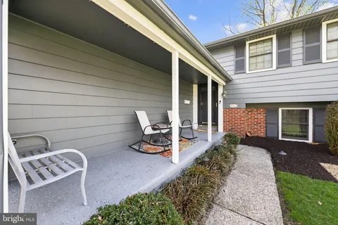 a front view of a house with a yard and porch