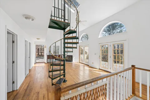a view of entryway with wooden floor