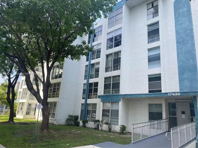 front view of a building with a yard