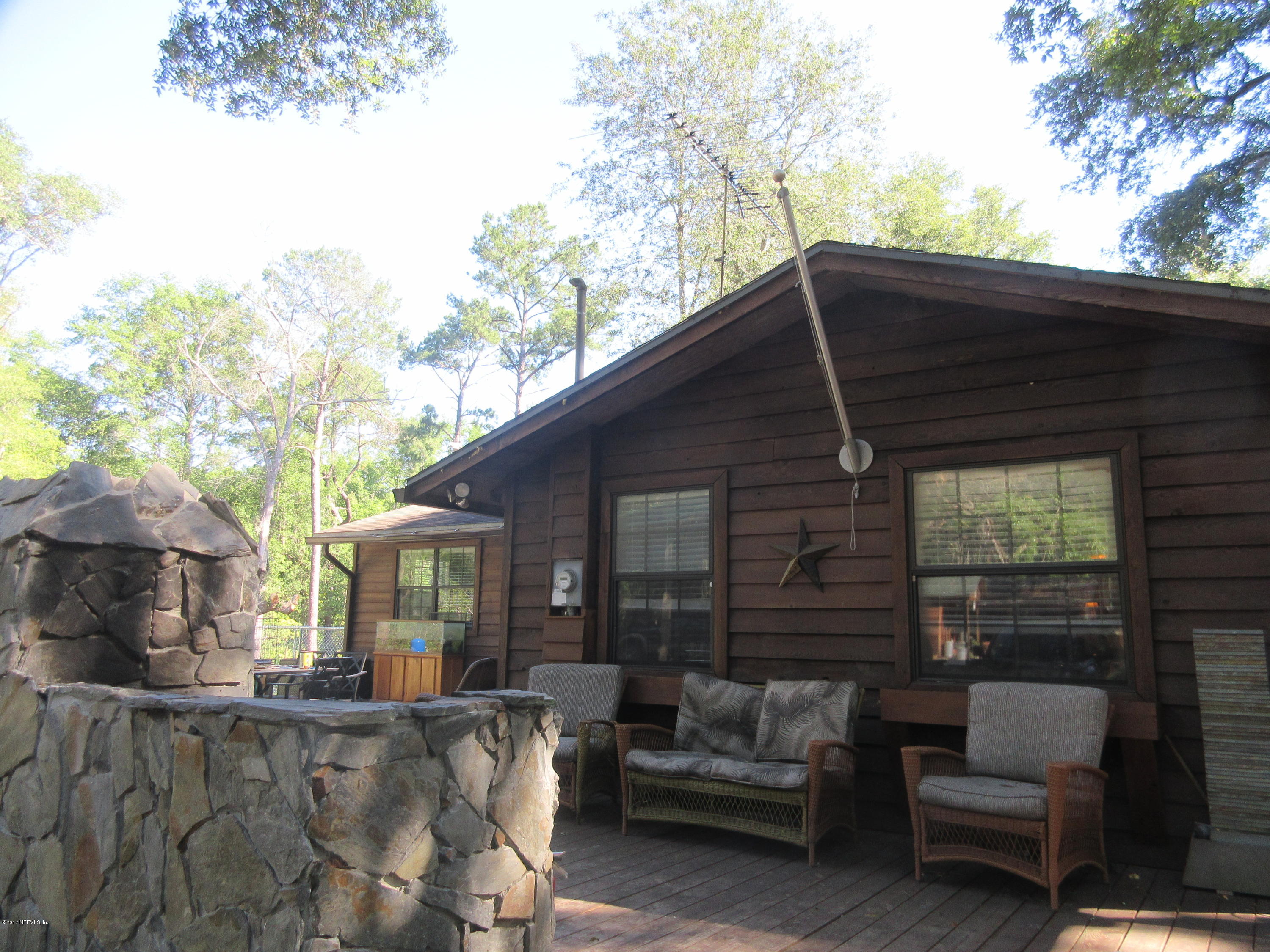 5824 Jones Creek Road Keystone Heights, FL 32656 - Photo 12 of 19 a view of a couches in the patio