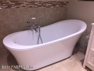 5824 Jones Creek Road Keystone Heights, FL 32656 - Photo 8 of 19 a white bath tub sitting in a bathroom