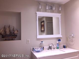 5824 Jones Creek Road Keystone Heights, FL 32656 - Photo 9 of 19 a bathroom with a sink mirror and vanity