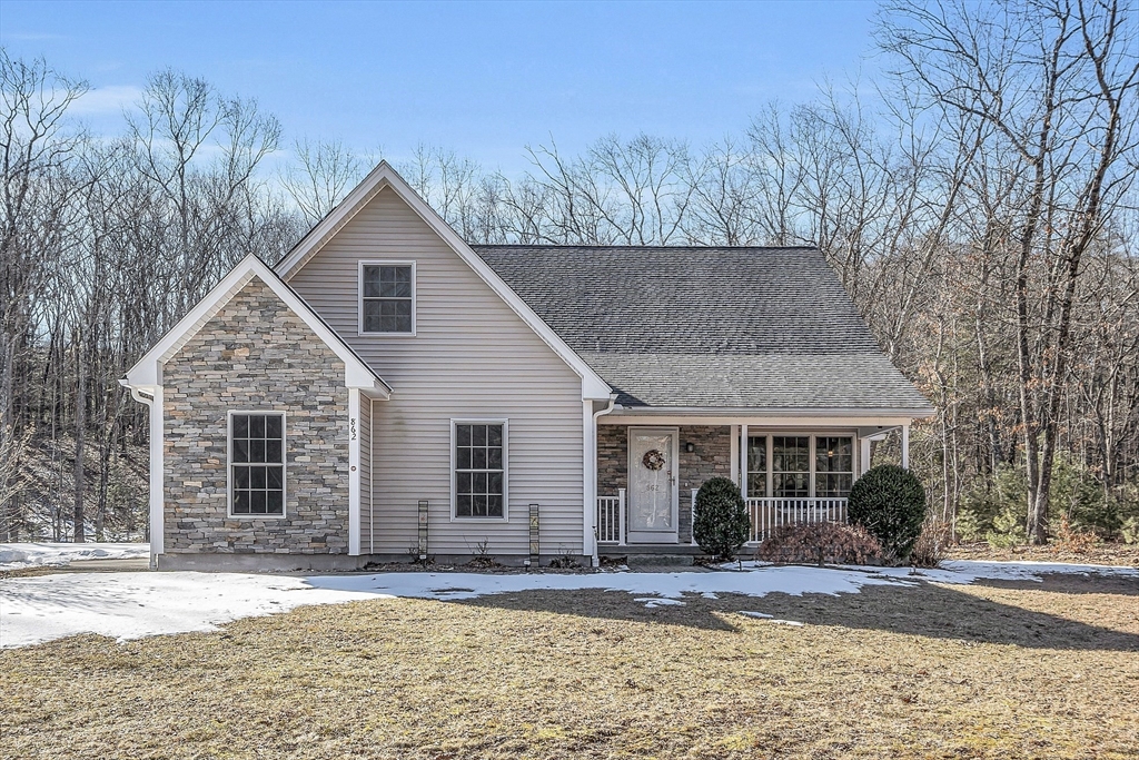862 Reservoir Road Lunenburg, MA 01462 - Photo 1 of 37 a front view of a house with a yard and garage
