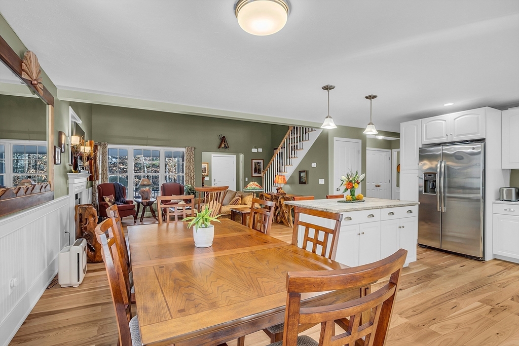 862 Reservoir Road Lunenburg, MA 01462 - Photo 14 of 37 a view of a dining area with furniture and chandelier