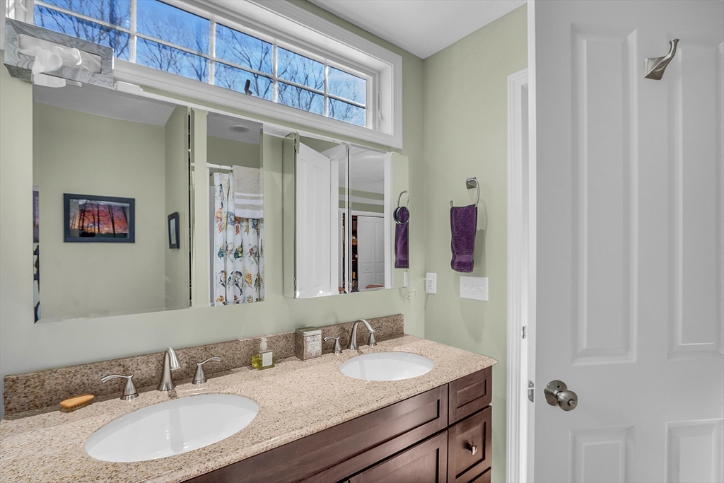 862 Reservoir Road Lunenburg, MA 01462 - Photo 23 of 37 a bathroom with a sink and a mirror