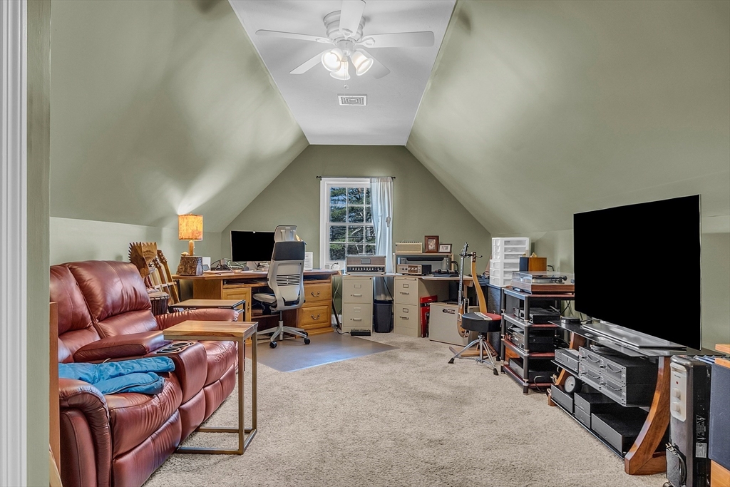 862 Reservoir Road Lunenburg, MA 01462 - Photo 30 of 37 a living room with furniture and a flat screen tv