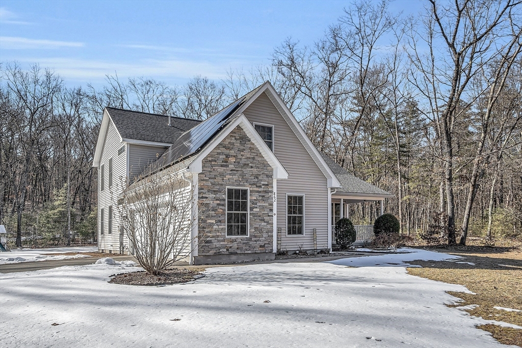 862 Reservoir Road Lunenburg, MA 01462 - Photo 3 of 37 a front view of a house with a yard
