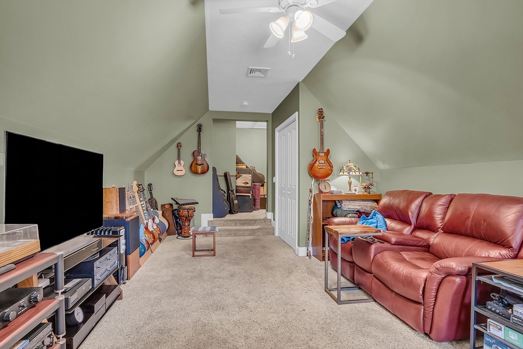 862 Reservoir Road Lunenburg, MA 01462 - Photo 31 of 37 a living room with furniture and a flat screen tv