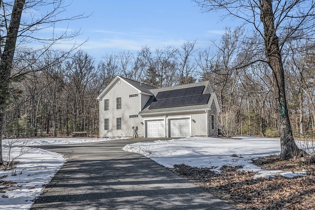 862 Reservoir Road Lunenburg, MA 01462 - Photo 4 of 37 a house with trees in the background