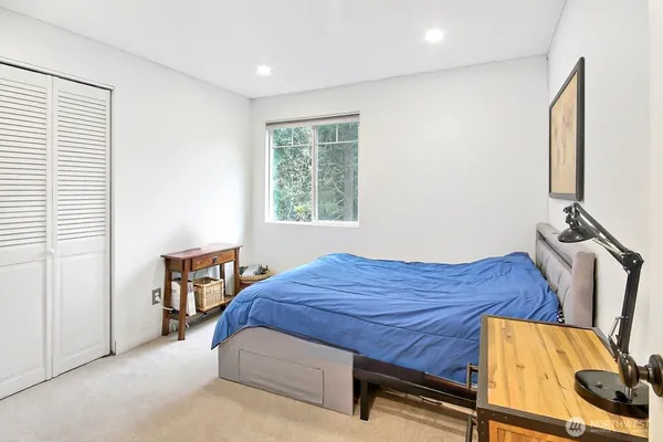 a bed room with a bed and a window