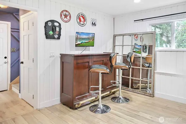 a view of front door with wooden floor