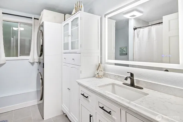 a bathroom with a double vanity sink mirror and double