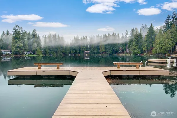 a view of a lake with sitting area