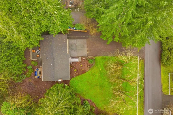 an aerial view of a house with a yard