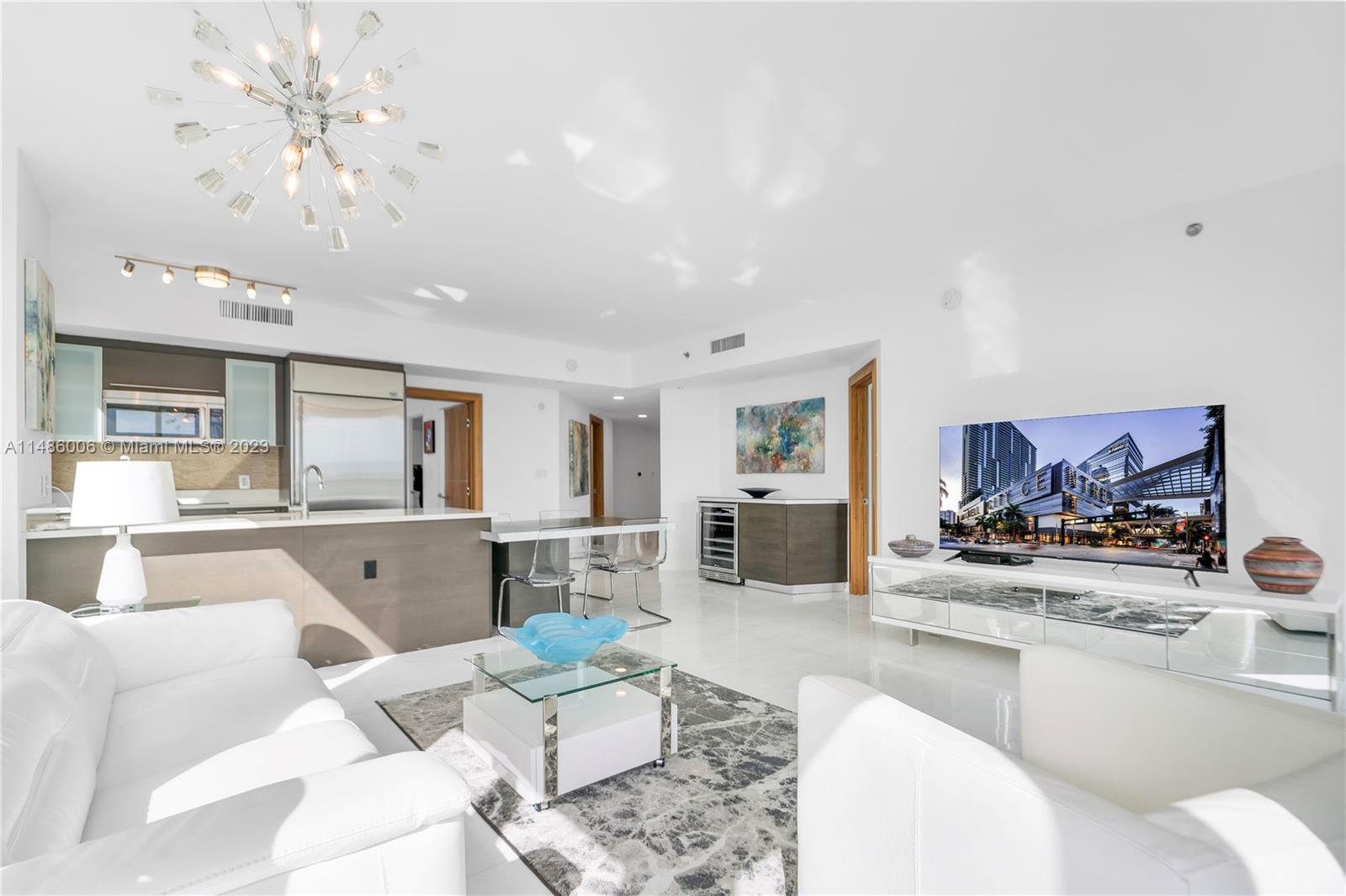 500 Brickell Avenue, Unit 2602 Miami, FL 33131 - Photo 12 of 38 a living room with furniture and view of kitchen